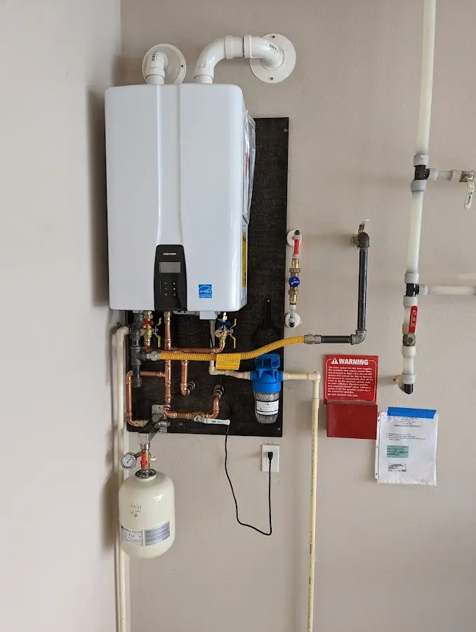 Professional plumber installing copper piping in a Marietta-Alderwood home